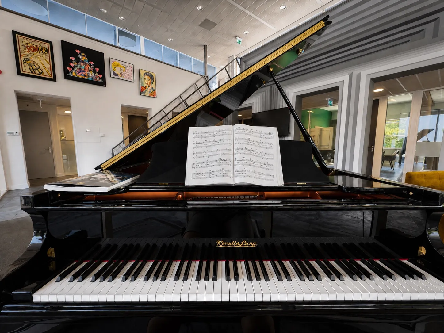 A colleague playing the piano at the office