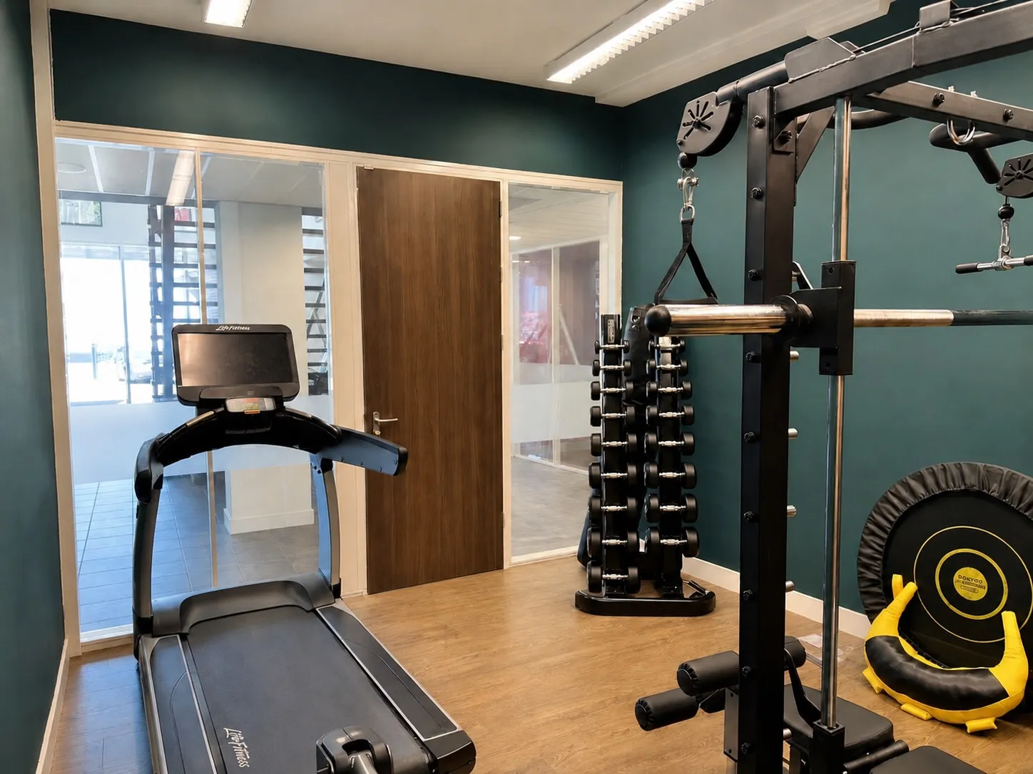 A colleague training in the office gym